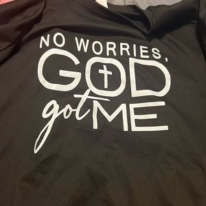 Black shirt with white letters.  Size says XXL but it fits like a Medium.